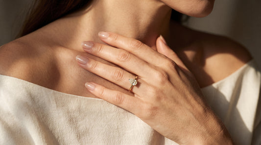 Iris Engagement Ring worn on hand — 1-carat lab-grown pear-cut diamond in 14k solid yellow gold by Nayiri Jewelry