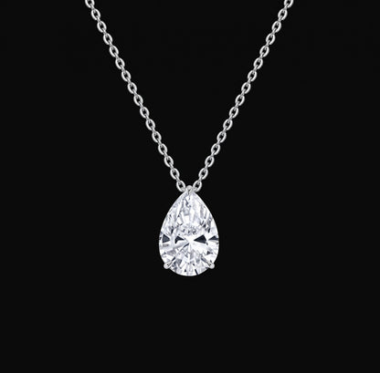 Lyra Necklace: pear-cut lab-grown diamond solitaire pendant on a white gold chain, black background