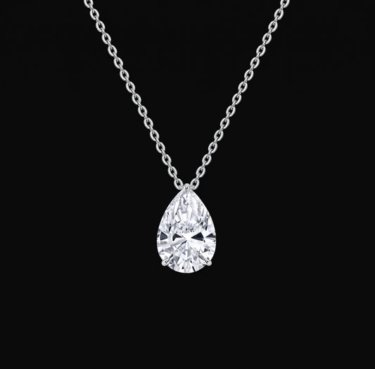 Lyra Necklace: pear-cut lab-grown diamond solitaire pendant on a white gold chain, black background