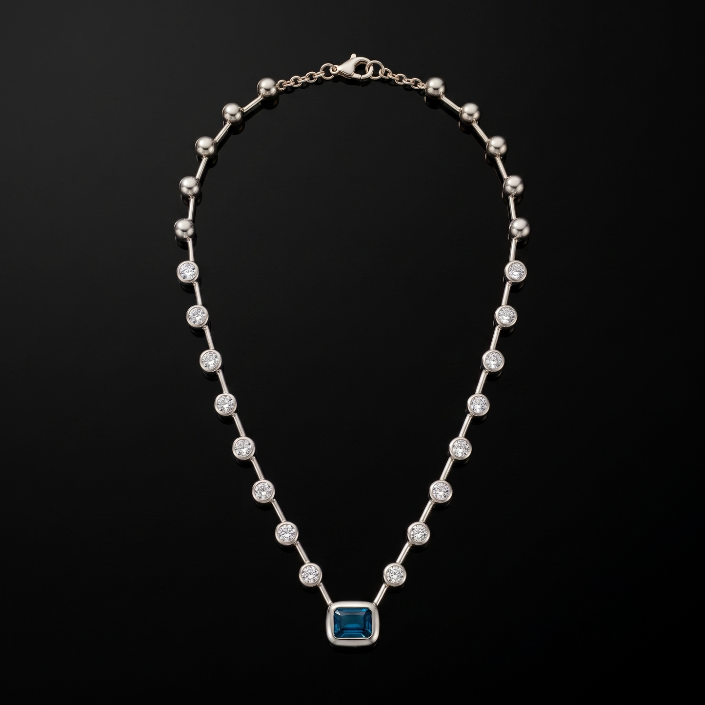 Skye Necklace — blue emerald-cut pendant, silver, studio