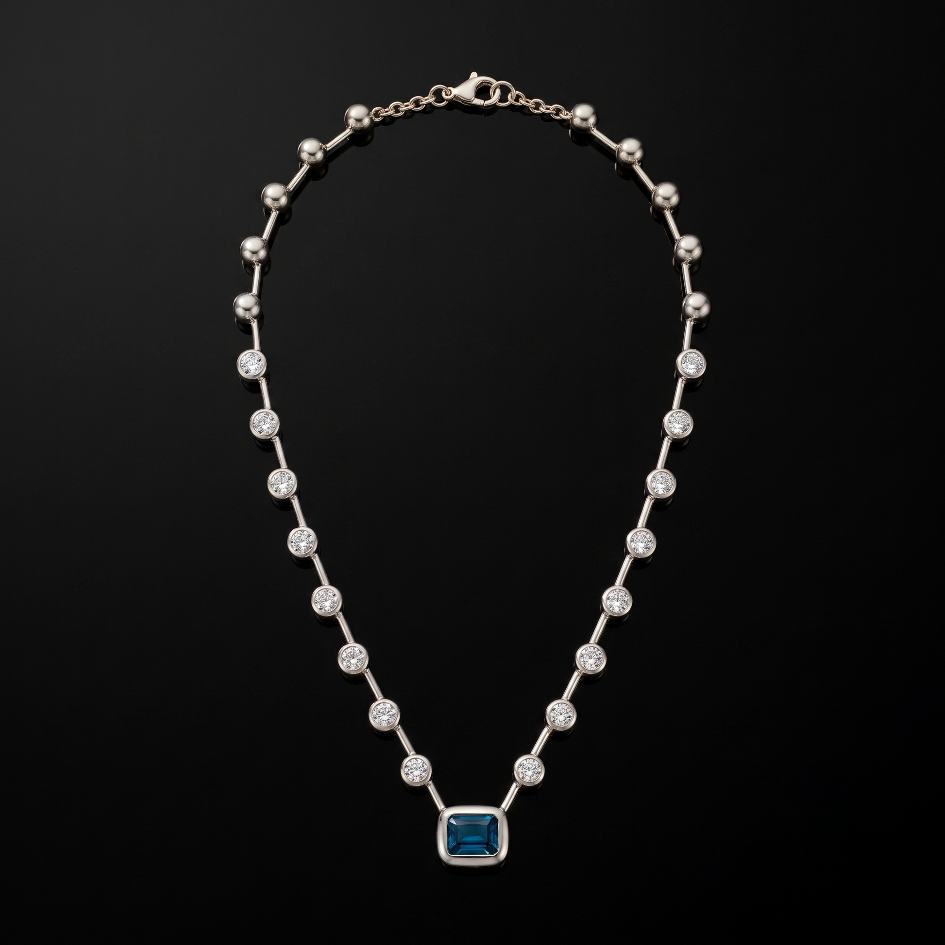 Skye Necklace — blue emerald-cut pendant, silver, studio